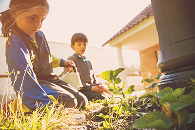 positive impact on society, children play in a garden